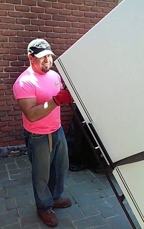 Derr's Hauling removing a refrigerator